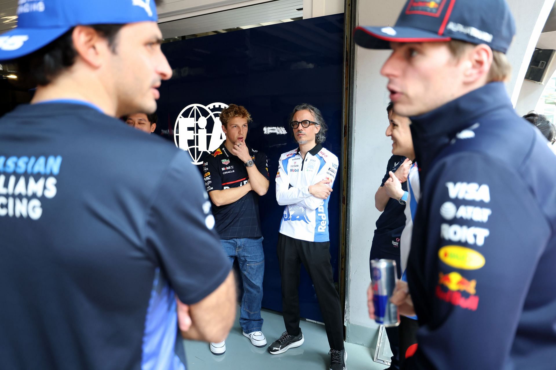 (L-R) Carlos Sainz, Liam Lawson, Laurent Mekies, and Max Verstappen at the Shanghai Circuit. Source: Getty